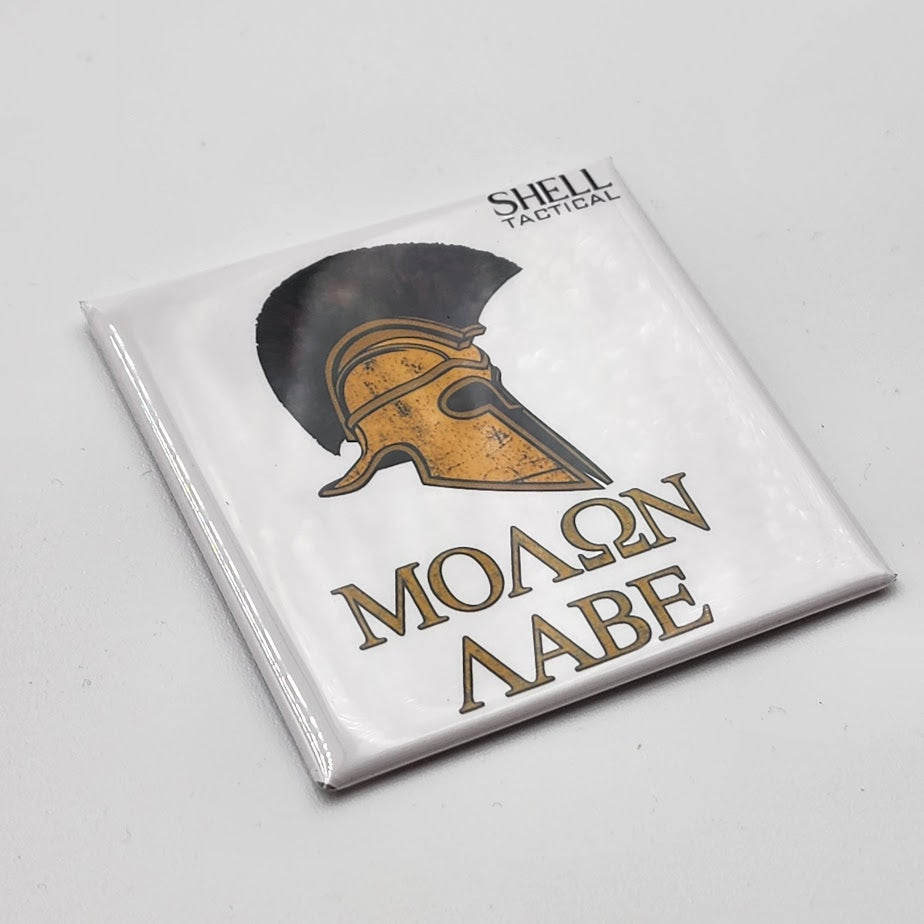 Packaged product with Spartan helmet design and 'Shell Tactical' branding on a gray background